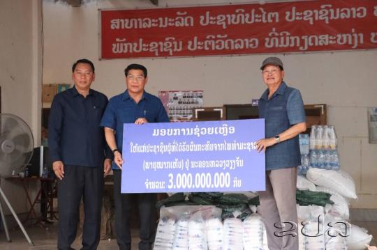 President Thongloun Inspects Storm Damage, Delivers Relief to affected Families