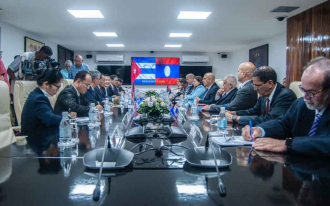 Cuba and Laos seek to build fairer society