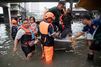 Philippines flooding displaces thousands, two missing