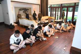 Lao Police Arrest 122 Suspected Online Scammers in Vientiane Raid